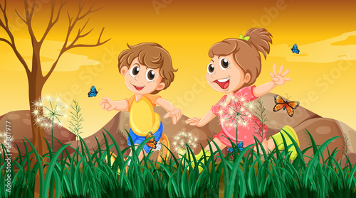 A girl and a boy playing with the butterflies