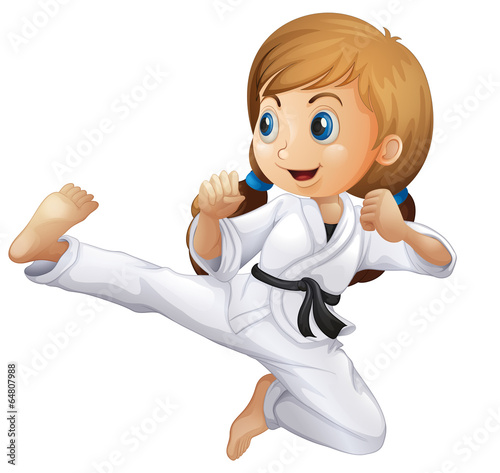 A young girl doing karate