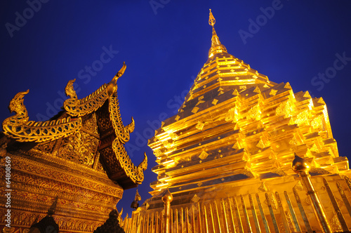 golden pagoda in twilight time , Chiangmai,Thailand photo