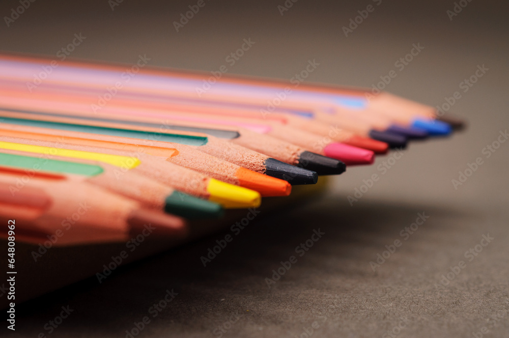 Pointed colorful pencils in a row Pointed colorful pencils in a row