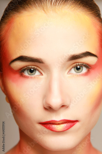 beautiful make up of bright lips  isolated on grey background