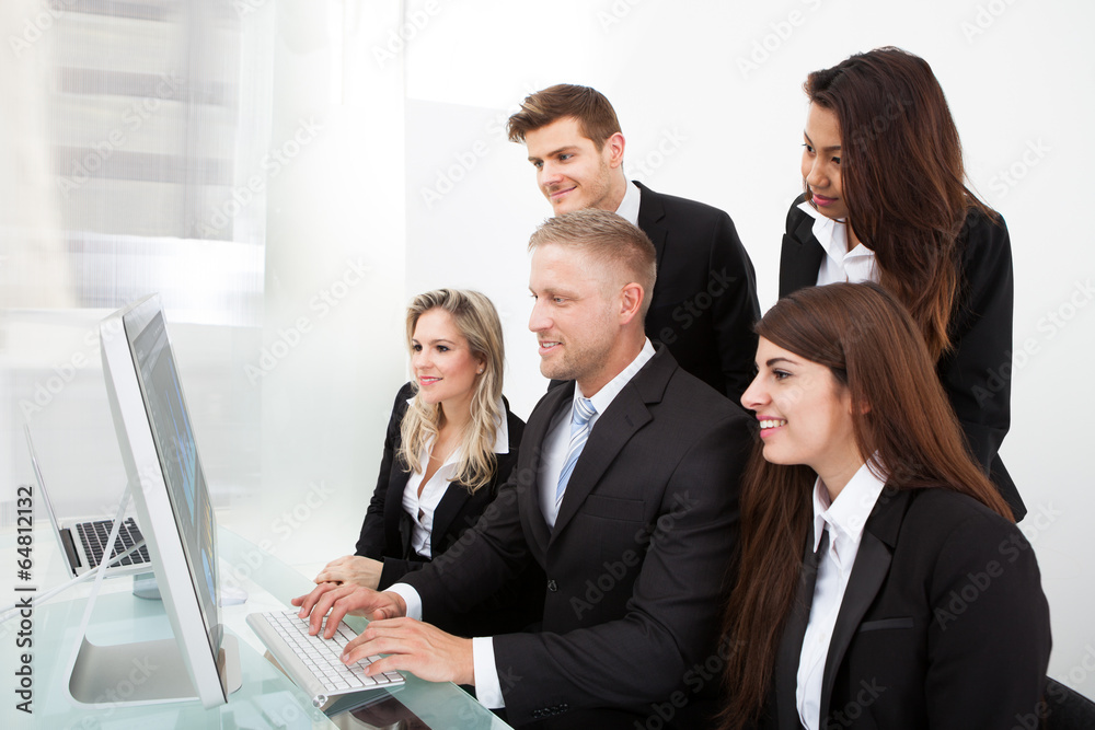 Businesspeople Using Desktop PC