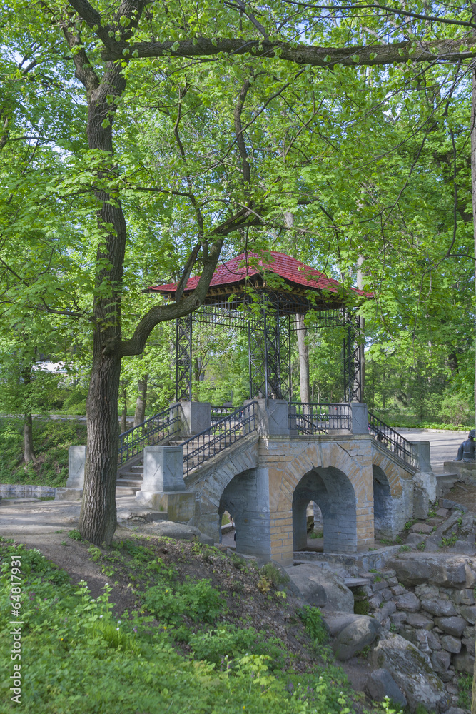 old spring park with stone bridge