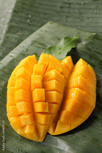ripe mango on banana leaf