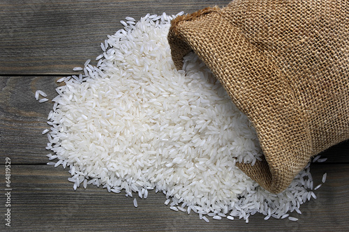 Fototapeta Raw rice in canvas sack