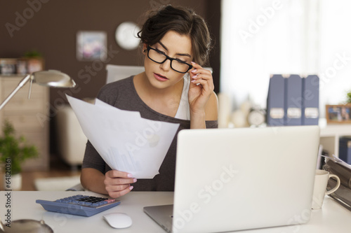 Young woman hard working at home photo