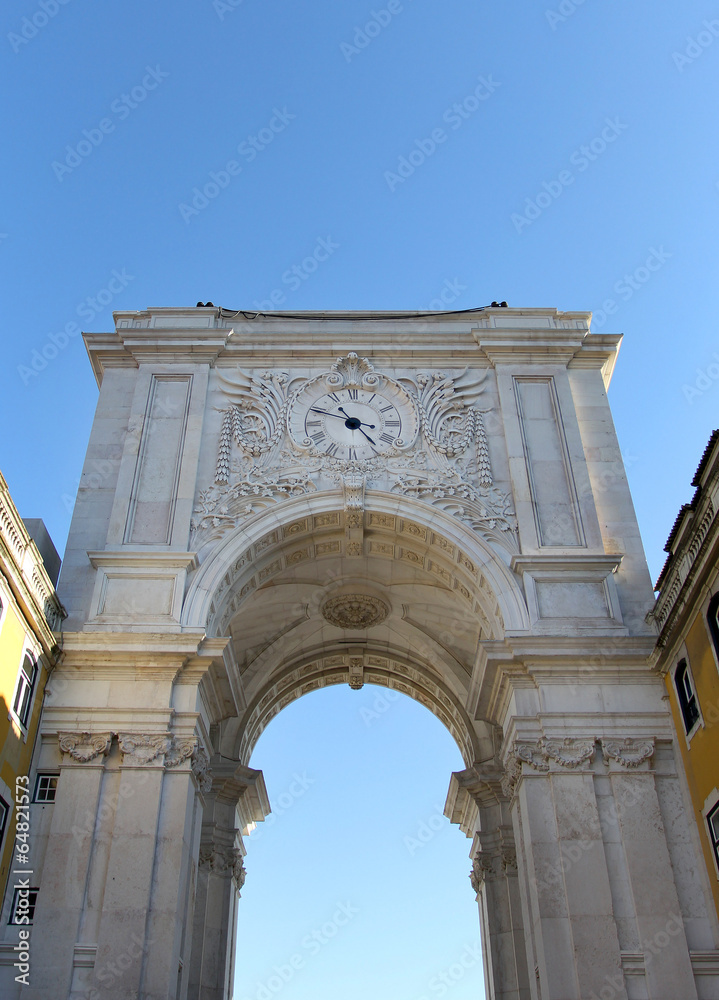 Old arch with watch in the center of Lisbon