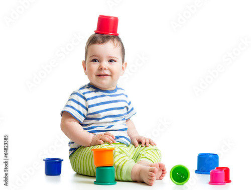 Funny little child is playi...