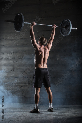 Athlete with barbell.