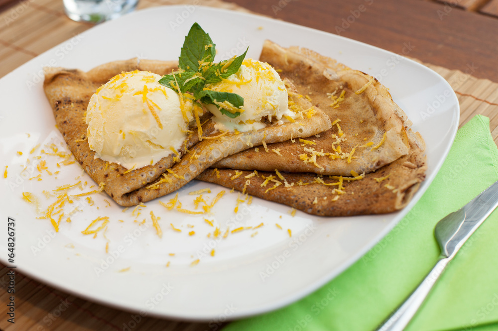 crepe with ice cream on wood table crepe with ice cream on wood table