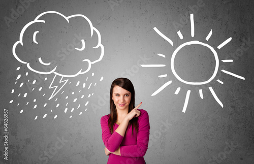 Woman standing between a sun and a rain drawing