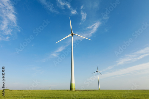 Wind power field with blue sky and white clouds