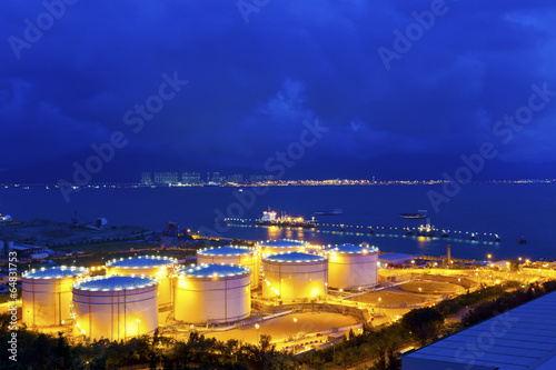 Big Industrial oil tanks in a refinery at night