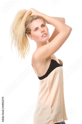 Sensual young woman with hands in hair