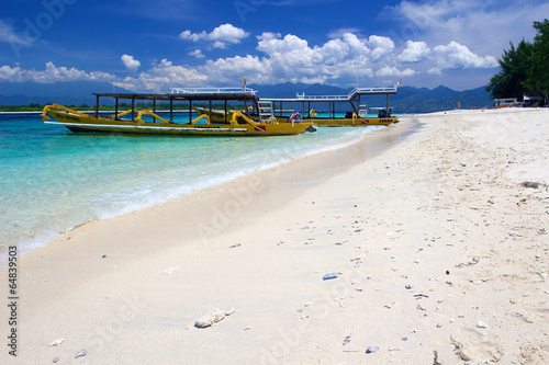 Yellow boats on beach on Gili Trawangan island