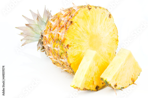 Ripes Pineapple with slices isolated on white