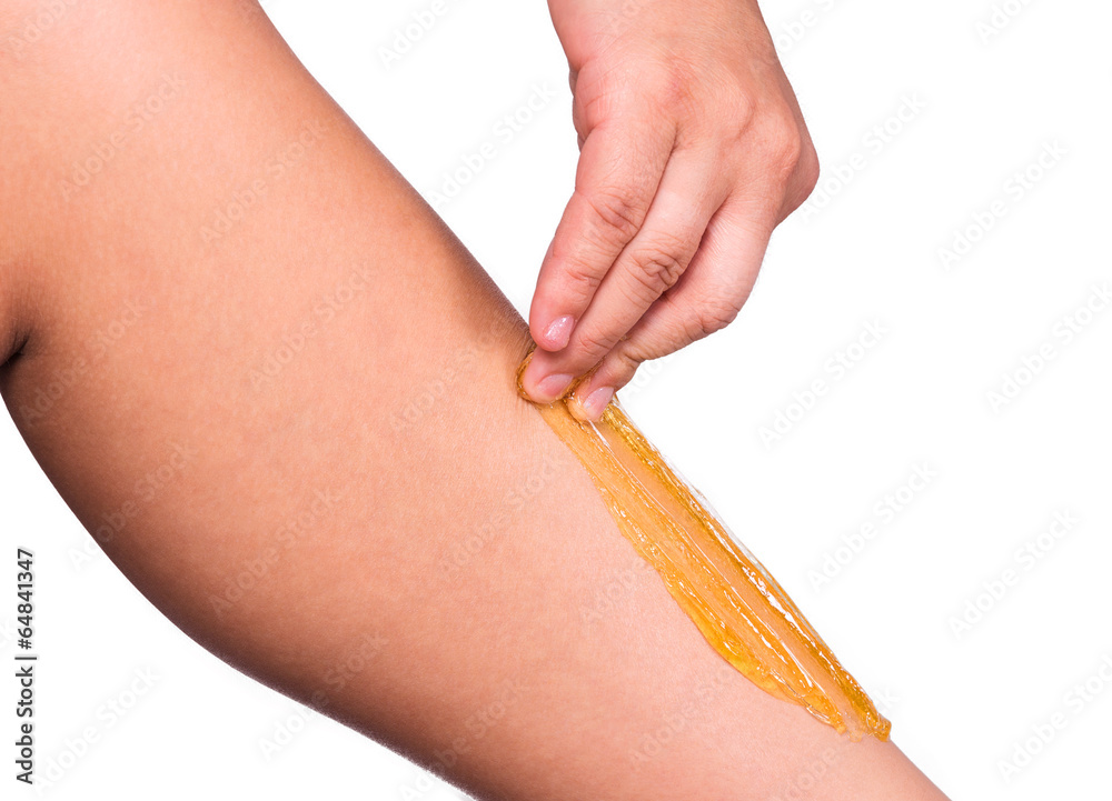 Sugaring: epilation with liquate sugar at legs. Sugaring: epilation with liquate sugar at legs.