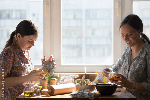 Two women cooking