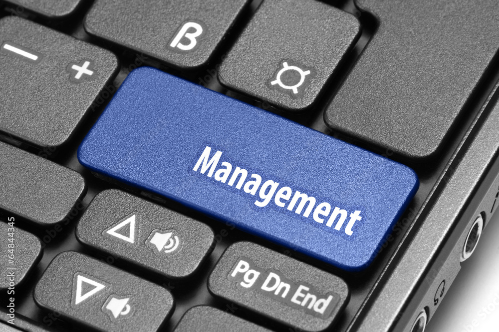 Management. Blue hot key on computer keyboard Management. Blue hot key on computer keyboard