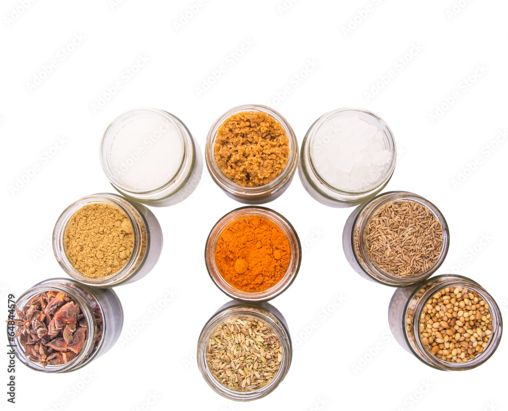 Different variety of sugar and spices over white background Different variety of sugar and spices over white background