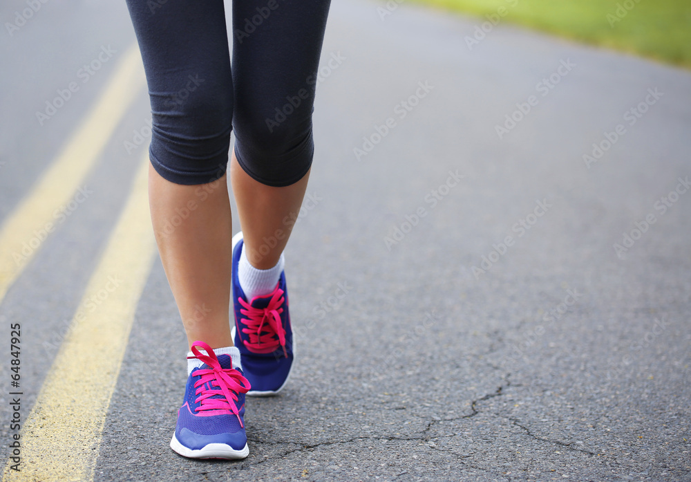 Runner Female Feet Running on Road. Jog Runner Female Feet Running on Road. Jog