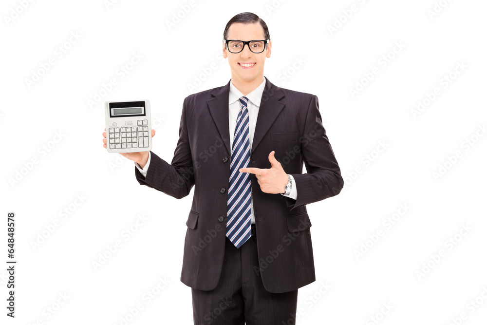 Businessman pointing towards a calculator Businessman pointing towards a calculator