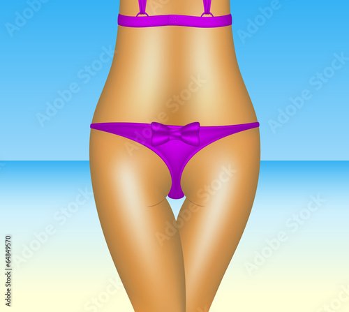 Sexy woman in purple bikini and beach background