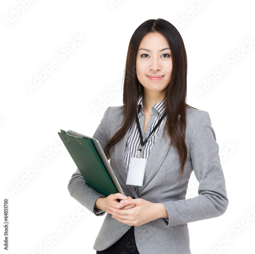 Asian businesswoman with file pad and laptop