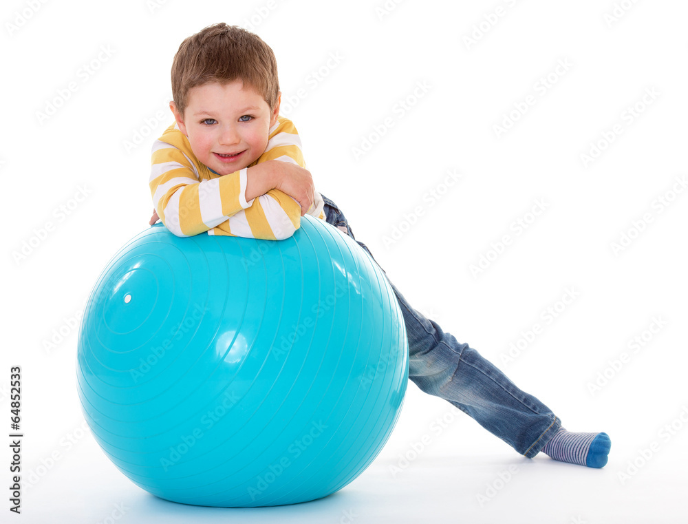 little boy with a big ball. little boy with a big ball.