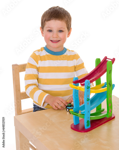 little boy playing at the table