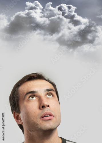 Male portrait against a stormy sky background. Intuition concept