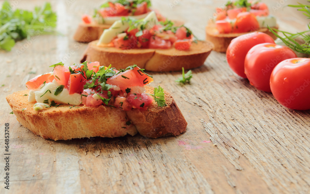 Italian antipasto with tomato, garlic and mozzarella Italian antipasto with tomato, garlic and mozzarella