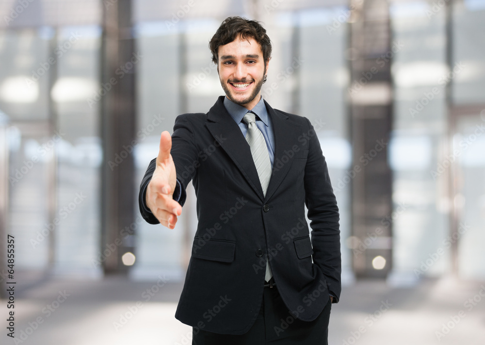 Businessman giving an handshake Businessman giving an handshake