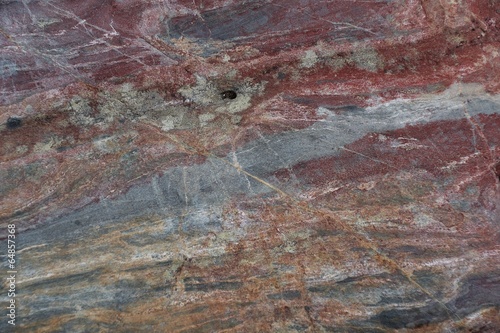 Surface of natural  stone - crimson quartzite porphyry photo