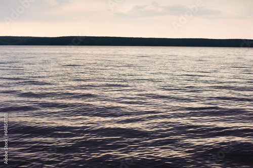 waves on a river in evening time