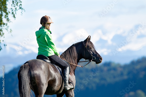 Woman riding horse