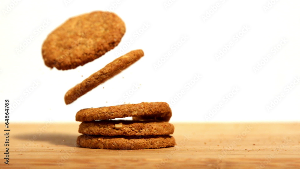 Biscuits falling on wooden table