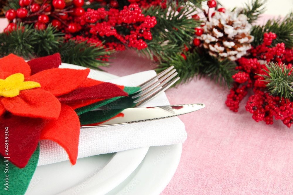 Christmas table setting with festive decorations close up Christmas table setting with festive decorations close up