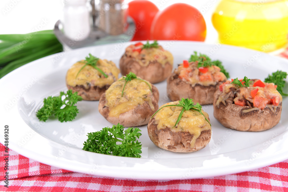 Stuffed mushrooms on plate on table close-up Stuffed mushrooms on plate on table close-up