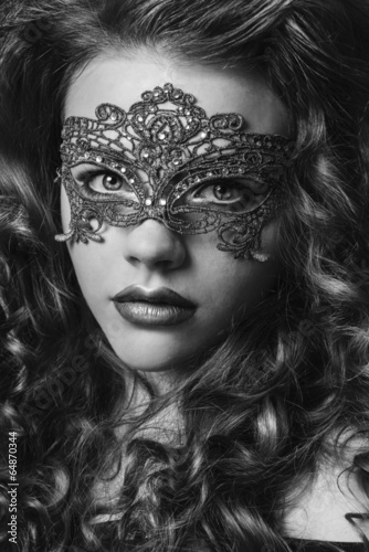 Beautiful Girl in a Carnival mask. Masquerade.Back and white bea