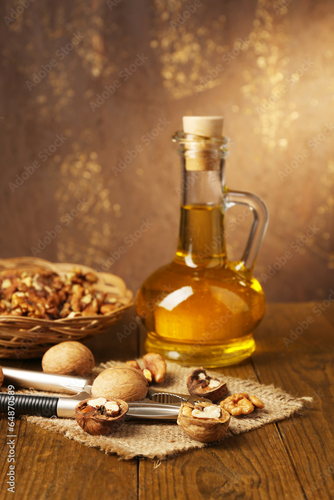 Walnut oil and nuts on wooden table Walnut oil and nuts on wooden table
