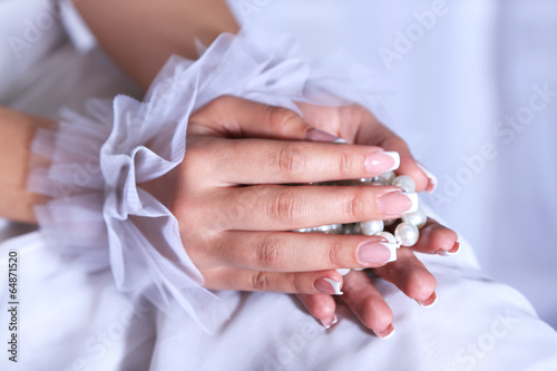 Wedding gloves on hands of bride, close-up