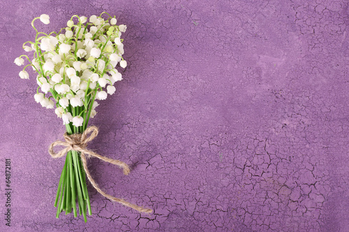 Fototapeta Naklejka Na Ścianę i Meble -  Beautiful lilies of the valley on old wooden background