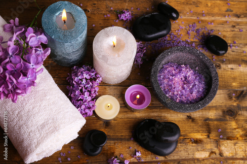 Composition with spa treatment, towels and lilac flowers,