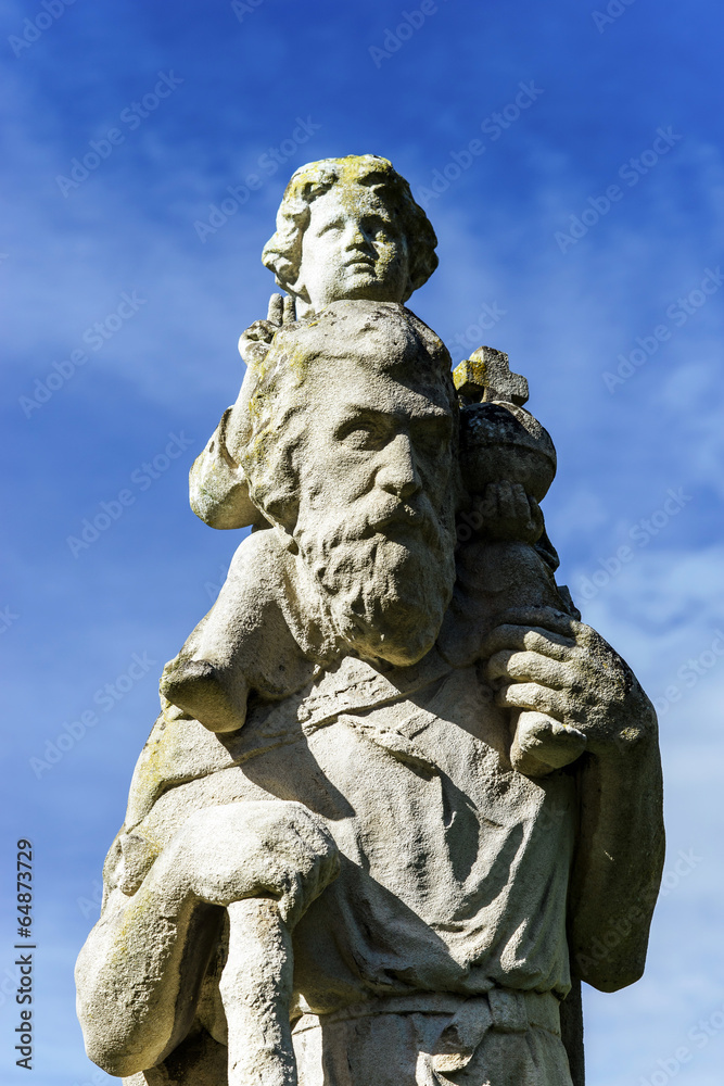 Fototapeta premium Jesus Christ sculpture composition near the church