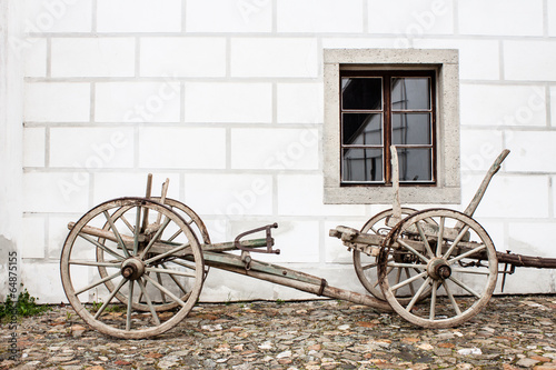 Vintage Old Wooden Ploughe with Renaissance Sgrafito Wall on Bac photo