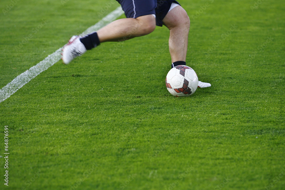 Soccer player and ball