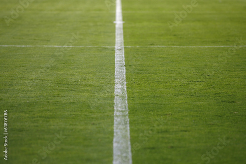 Soccer field with white lines on grass