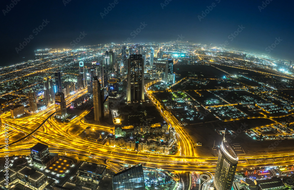 Dubai downtown night scene with city lights,