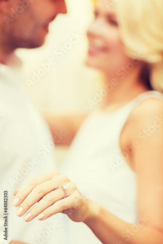 romantic man proposing to beautiful woman